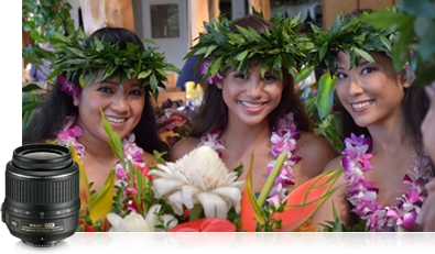 Included 18-55mm NIKKOR lens Photo of three hula girls in Hawaii and a product shot of the 18-55mm lens