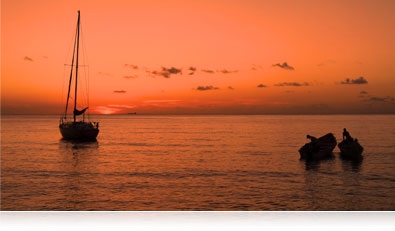 low-light photo of boats at sunset on the water highlighting the AW120's CMOS sensor